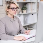 busy-businesswoman-working-in-office-PAESWHB.jpg